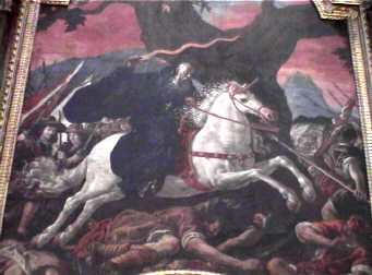 Obra de Rizzi, este lienzo forma parte del retablo de la iglesia de San Millán de Yuso, y conmemora la aparición de San Millán en  la batalla de Hacinas. 